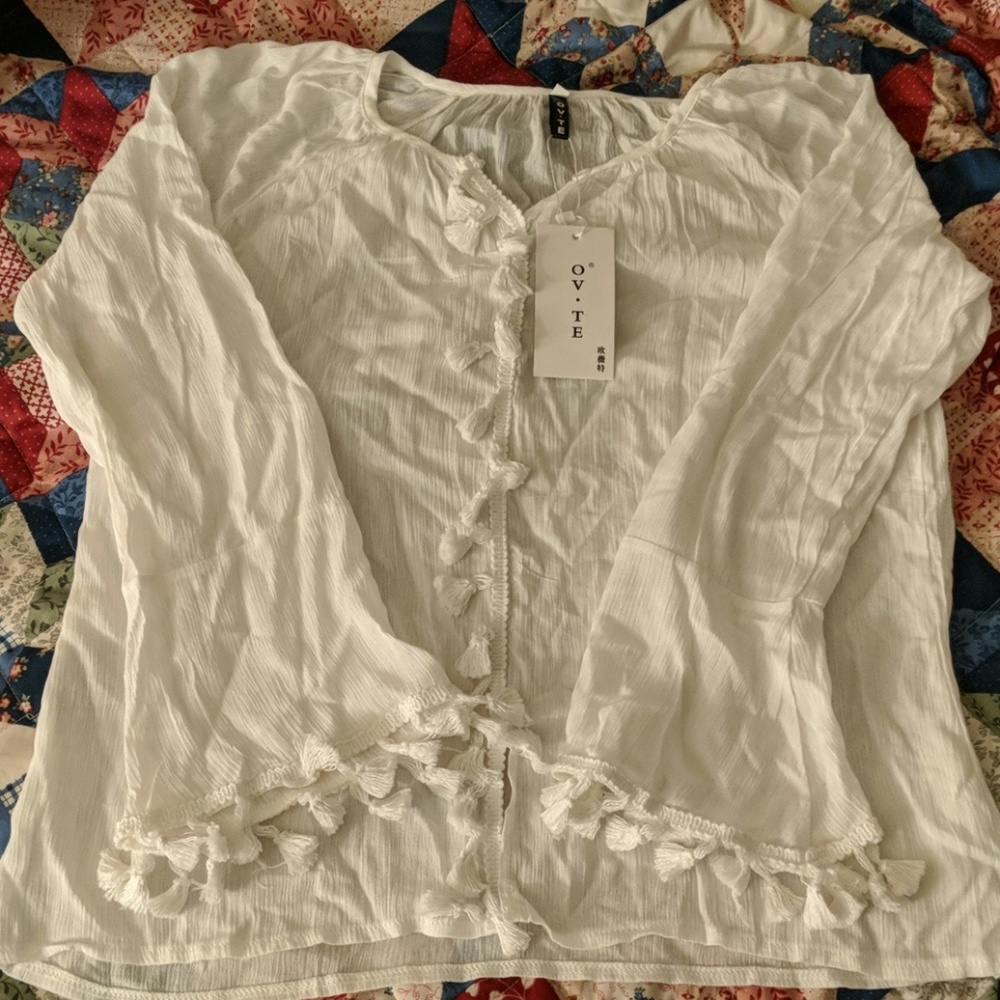 White top with fringe detail